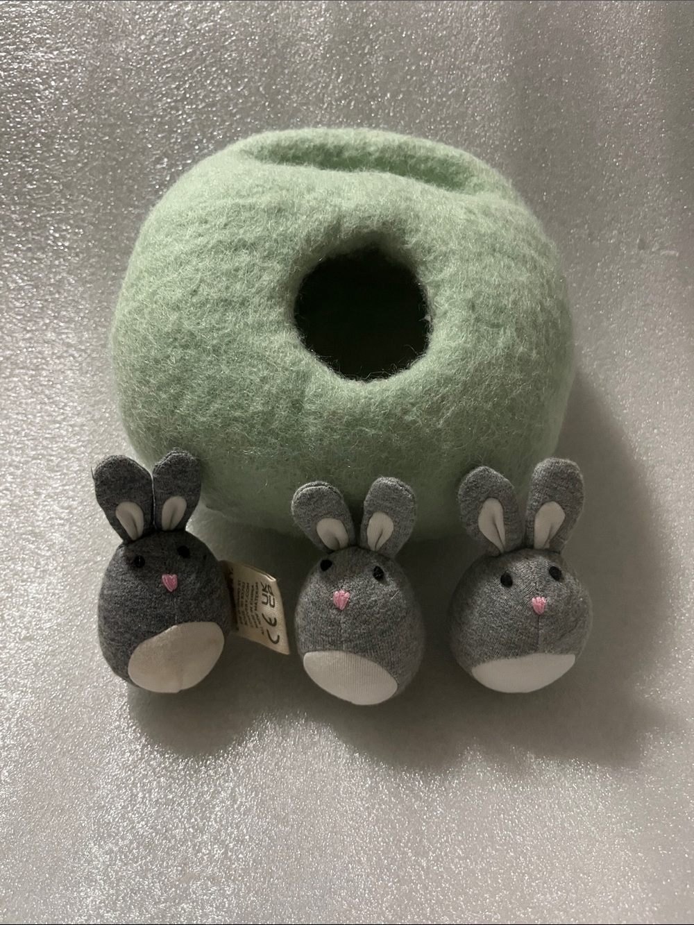 Lovevery bunnies in a felt burrow
